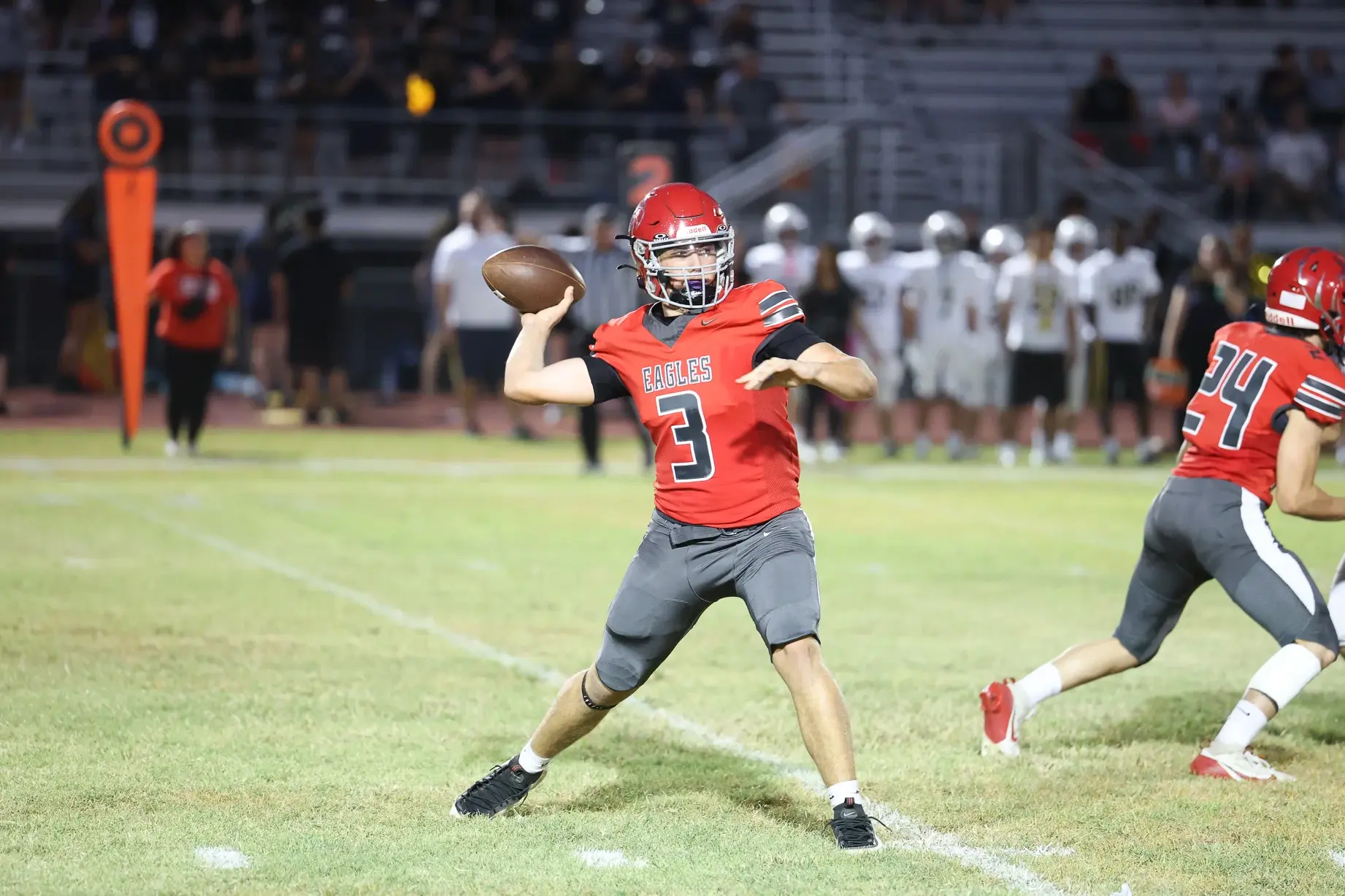 QB throwing the ball to his WR